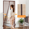 Woman opening a magnetic screen door in a modern living room.