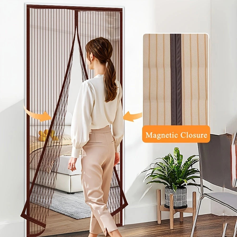 Woman opening a magnetic screen door in a modern living room.