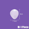 A translucent white teardrop-shaped adhesive pad shown on a solid purple background with white dimension lines indicating 7.5cm width and 9cm height, plus the text 'M-1 Piece' in the bottom right corner.