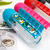 Colorful pill organizer with various pills on a light surface.