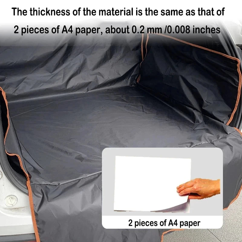 Car trunk with a black cover, showing the thickness comparison to two pieces of A4 paper.