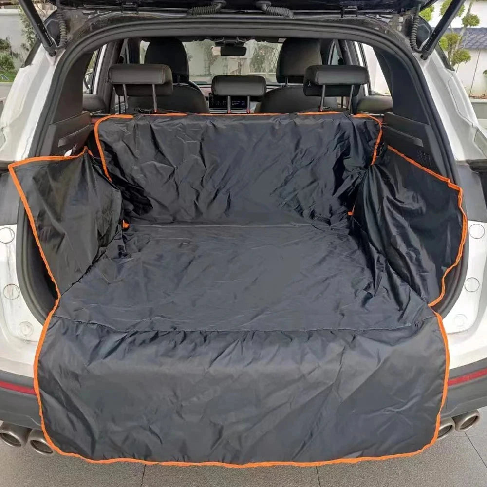 A black cargo liner with orange trim installed in the open trunk of a white SUV, showing the interior of the trunk and rear seats.