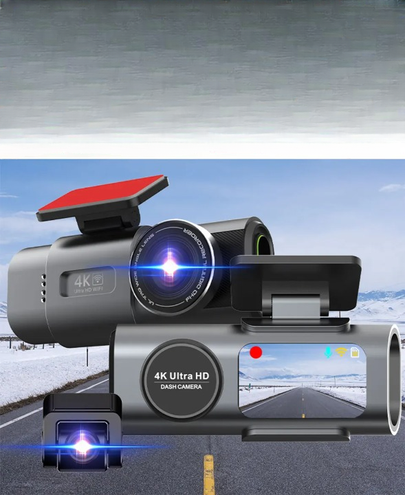 A 4K ultra HD dash camera shown in multiple angles against a snowy road background. The camera is dark gray with a red mounting bracket and a small color screen displaying a road scene.