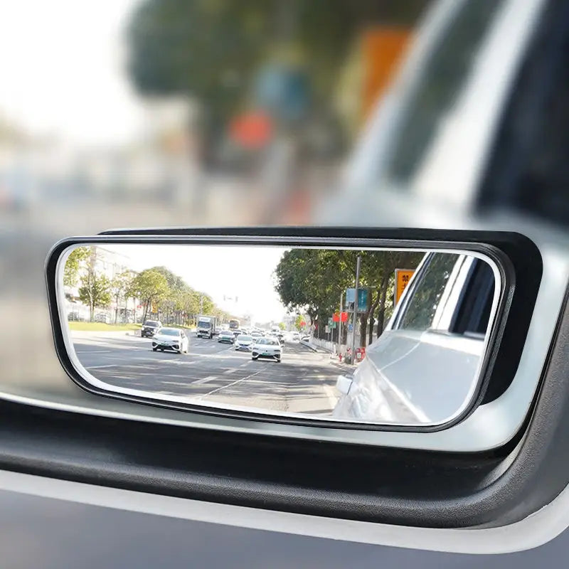 Car rearview mirror with wide-angle view of road and traffic