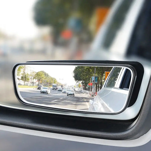 Car rearview mirror with wide-angle view of road and traffic