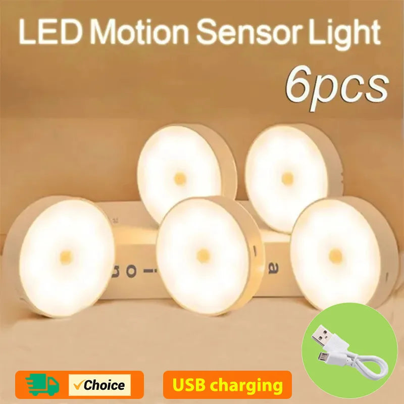 Set of LED motion sensor lights with USB charging feature on a beige background
