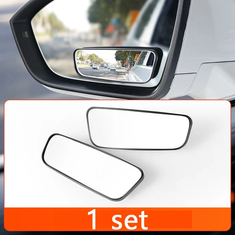 Car side mirror with a close-up of two additional mirrors on a white background.