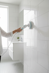 Cordless spin scrubber cleaning sparkling white bathroom tiles, satisfying clean home aesthetic